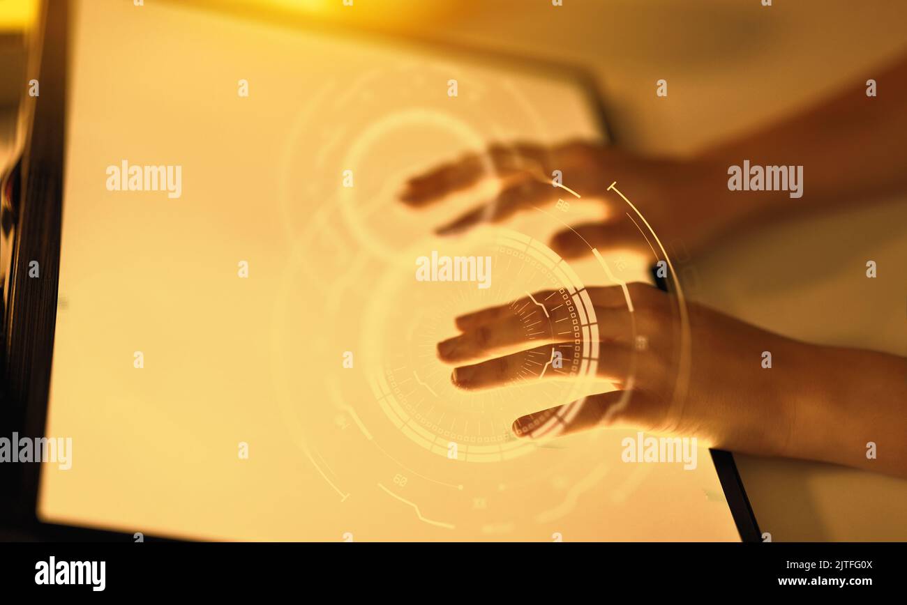hands on led light tablet at night office Stock Photo