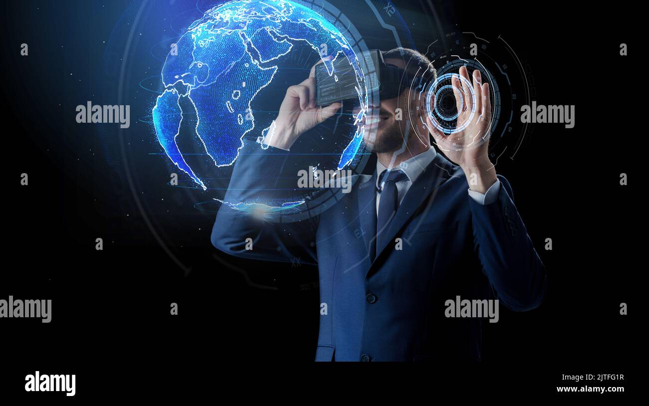 businessman in virtual reality headset over black Stock Photo