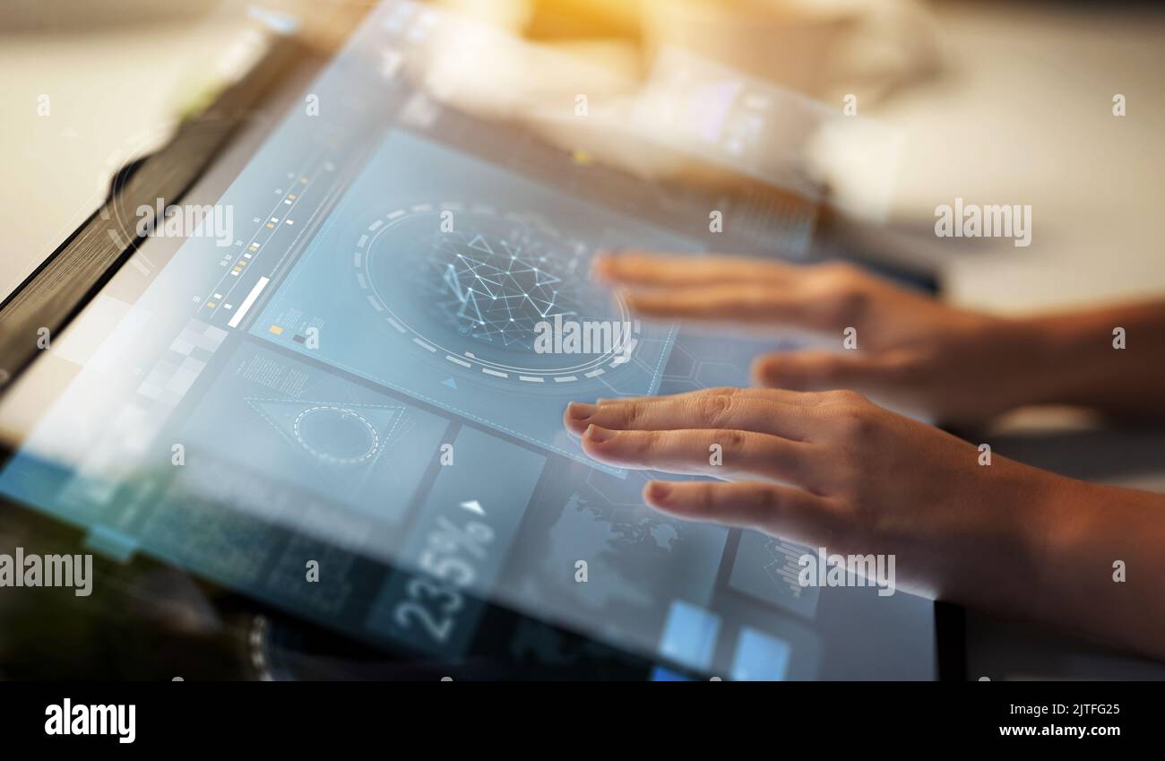 hands on led light tablet at night office Stock Photo