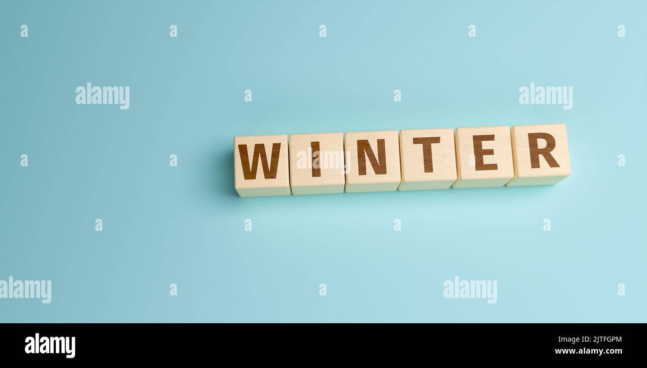 The word Winter built from letters on wooden cubes. High angle view with copy space Stock Photo