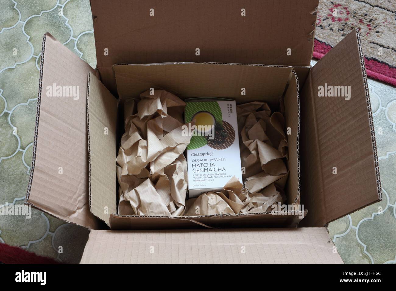 Item in overpackaged cardboard boxes. Environmentally unfriendly excess packaging Stock Photo