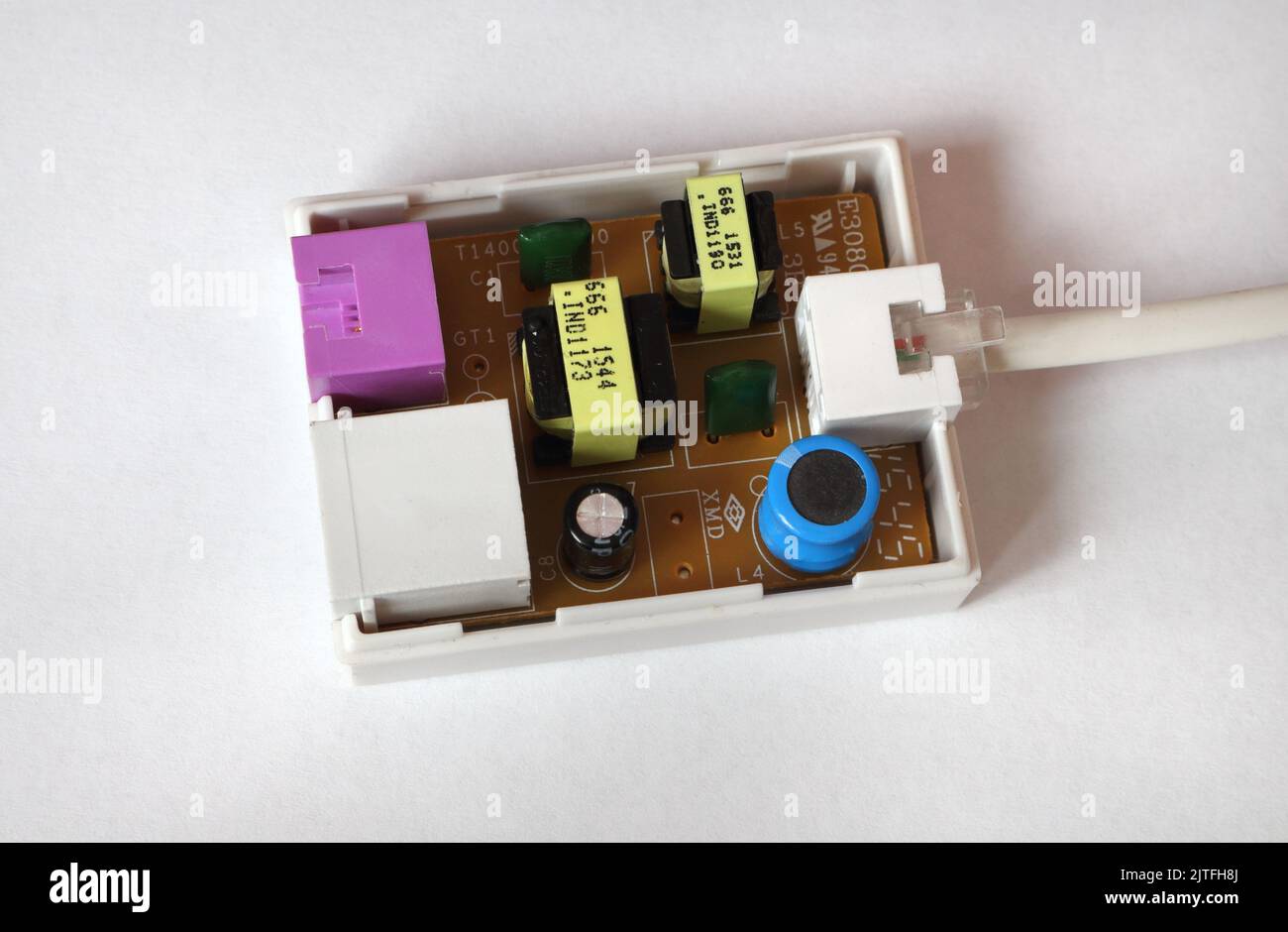 Broadband filter, telephone line filter, inside view showing electronic components Stock Photo