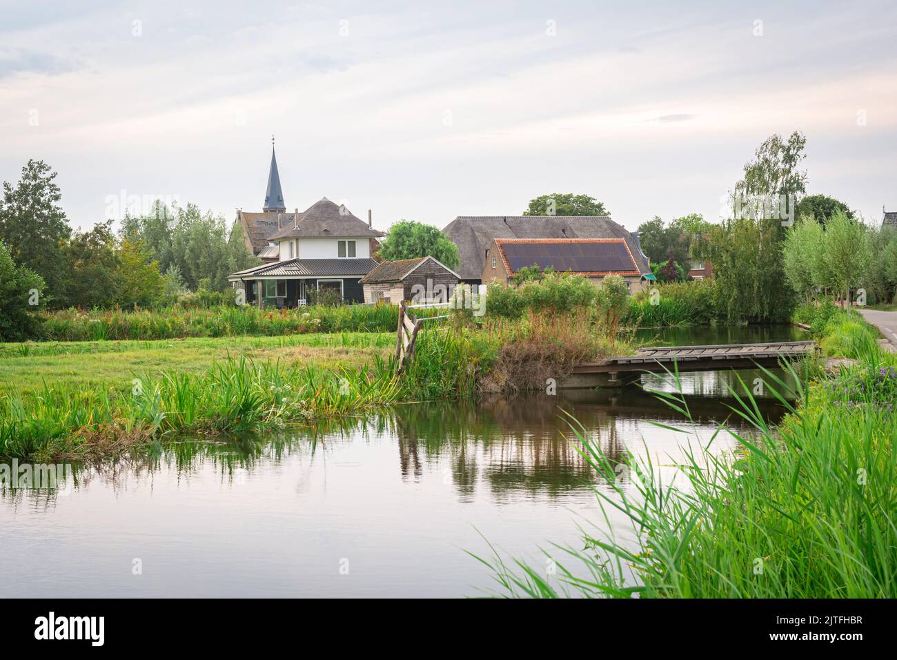 dyllic image of the village of Reeuwijk-Dorp and the surrounding watery countryside Stock Photo