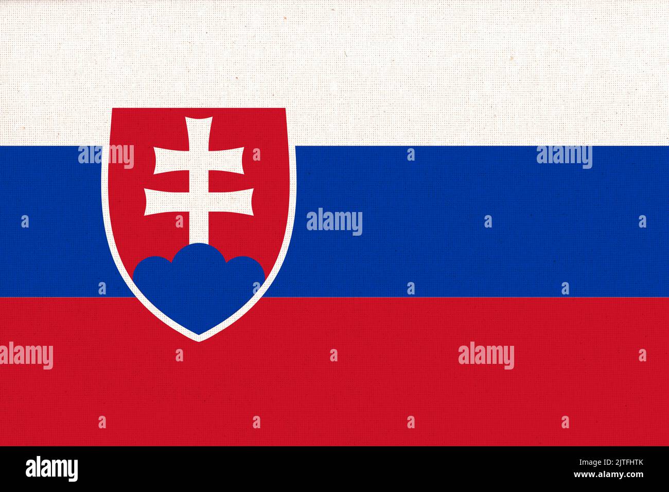Flag of Slovakia. Slovak flag on fabric texture. National Slovak symbol. Slovak national flag. Slovak Republic Stock Photo