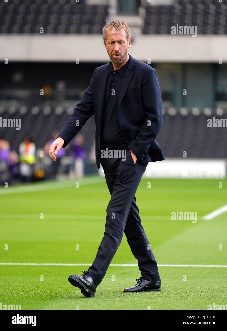 Brighton and Hove Albion manager Graham Potter inspects the pitch before the Premier League match at Craven Cottage, London. Picture date: Tuesday August 30, 2022. Stock Photo