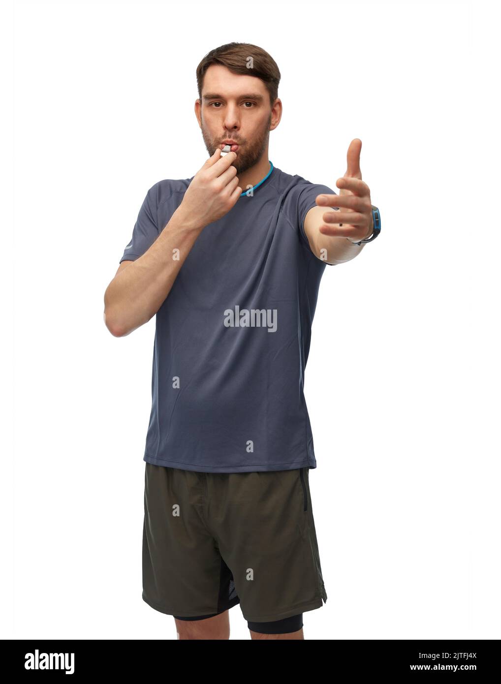 male trainer or referee whistling whistle Stock Photo Alamy