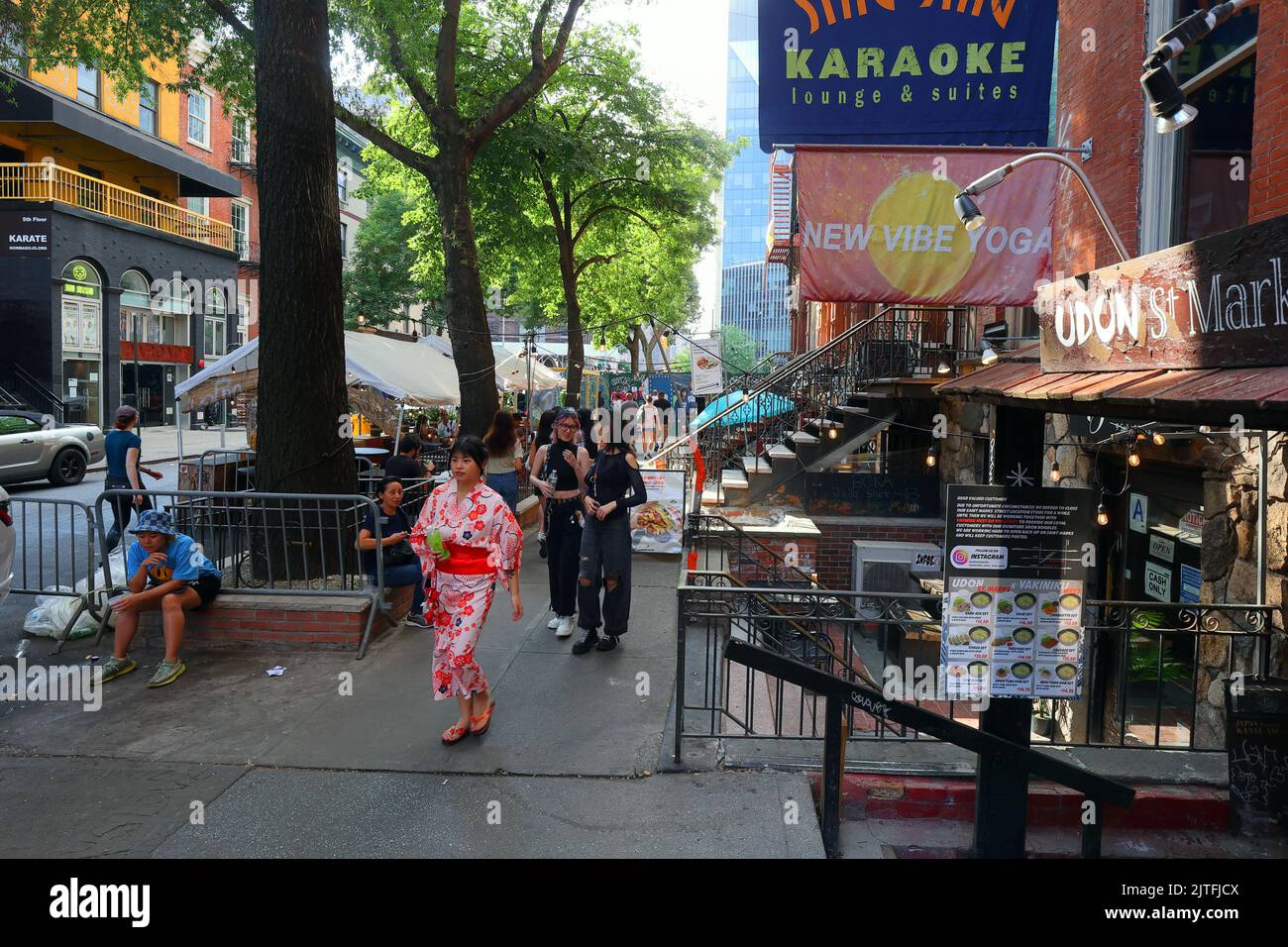 Asian Americans walking along St. Marks Pl in Manhattan's 'Little Tokyo' East Village neighborhood, New York City. Stock Photo