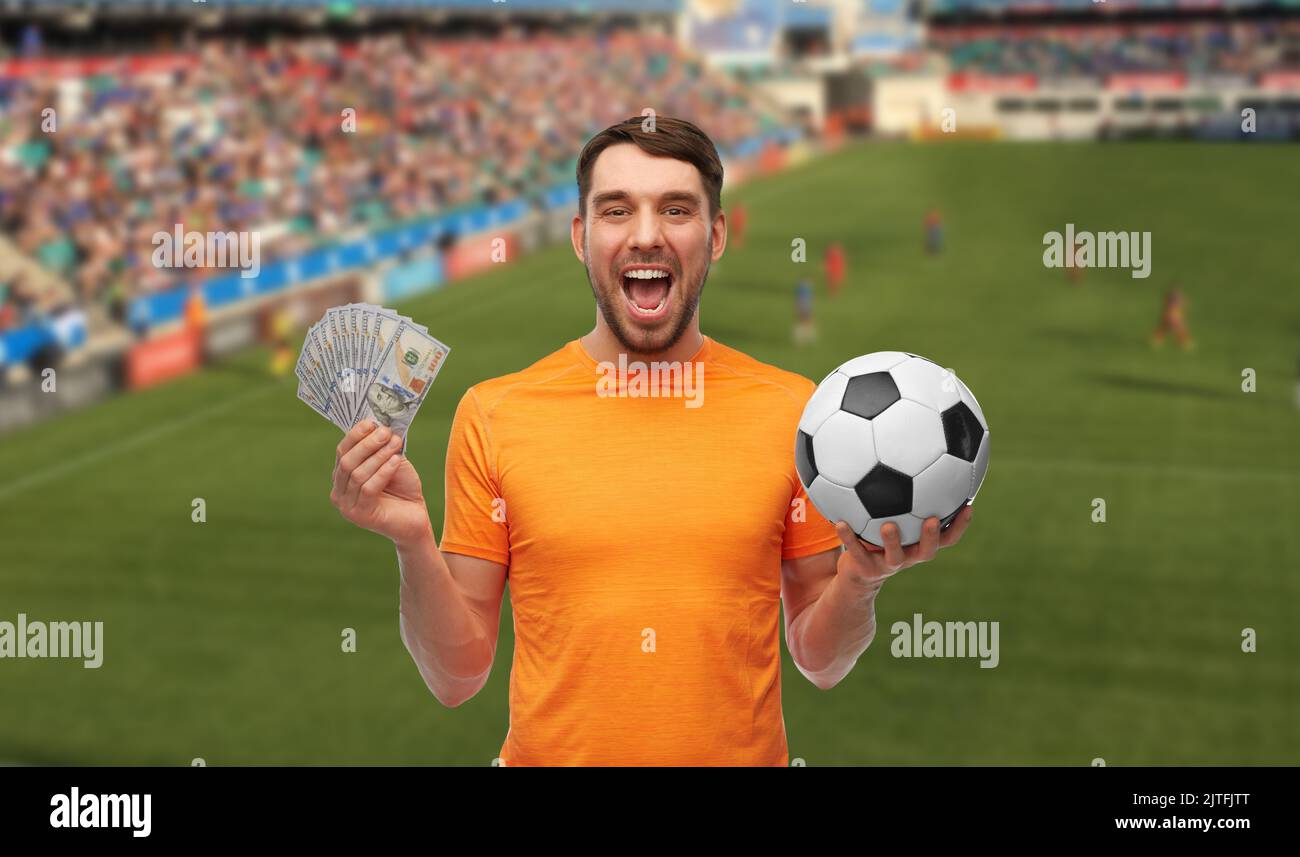 happy football fan with soccer ball and money Stock Photo Alamy