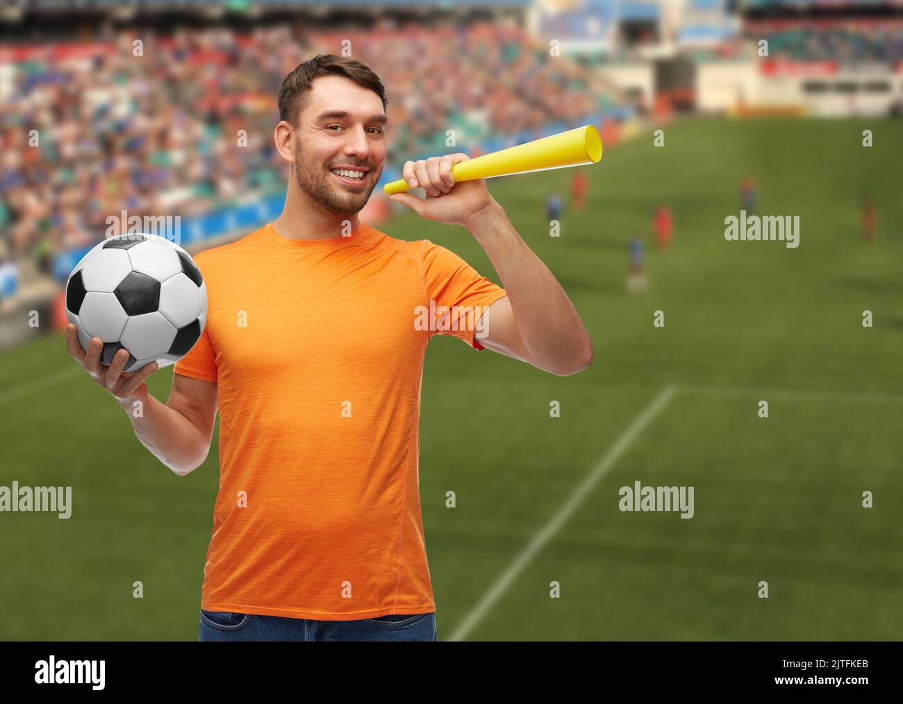 male football fan with soccer ball and vuvuzela Stock Photo Alamy