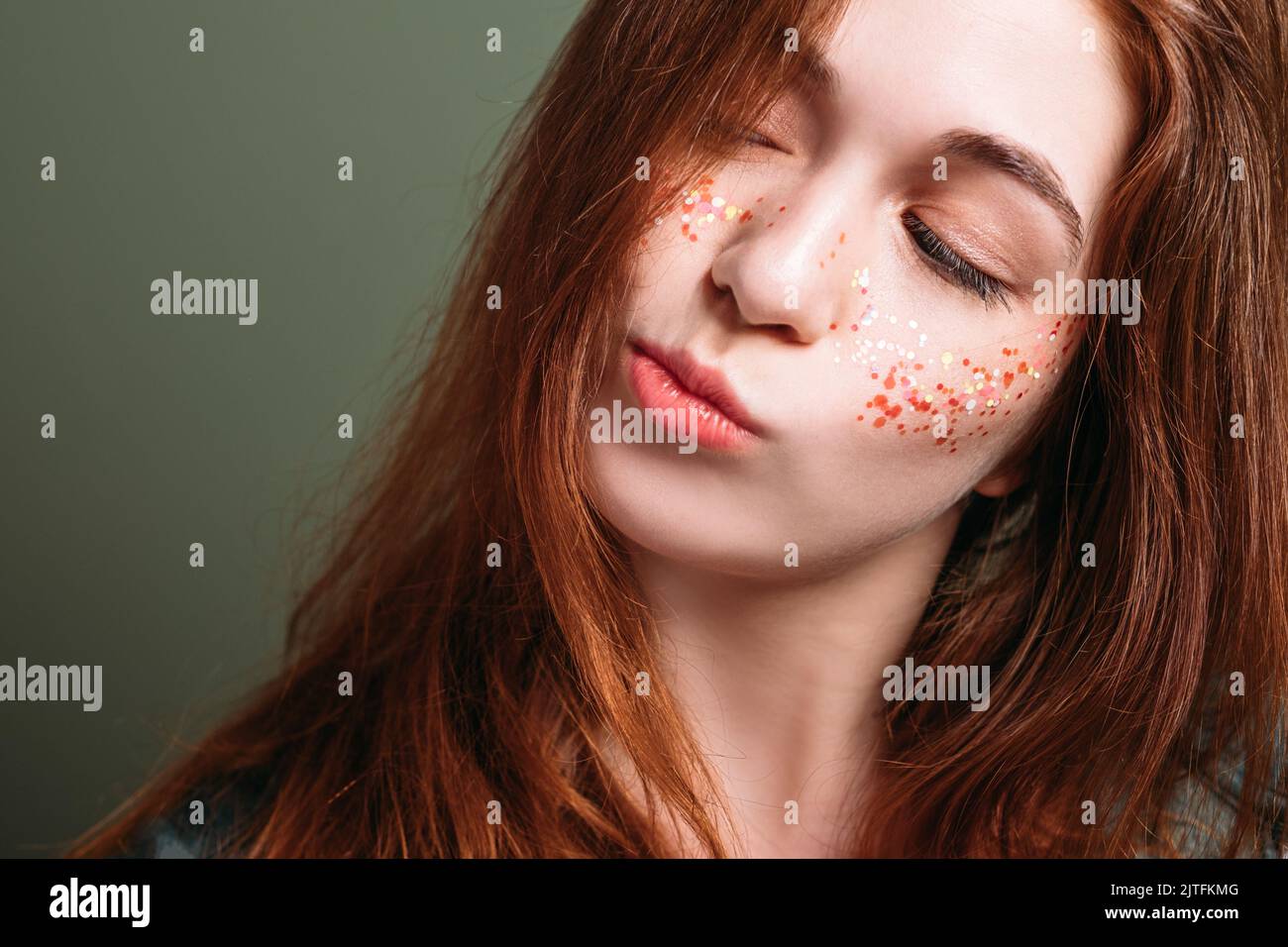 young woman skeptical facial expression pout lips Stock Photo