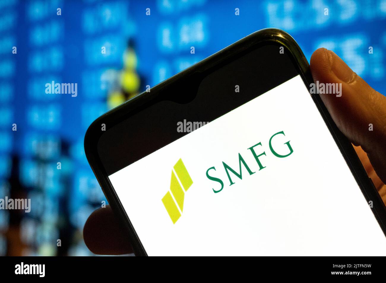 In this photo illustration, the Japanese multinational banking and financial company Sumitomo Mitsui Financial Group SMFG logo is displayed on a smartphone screen. Stock Photo