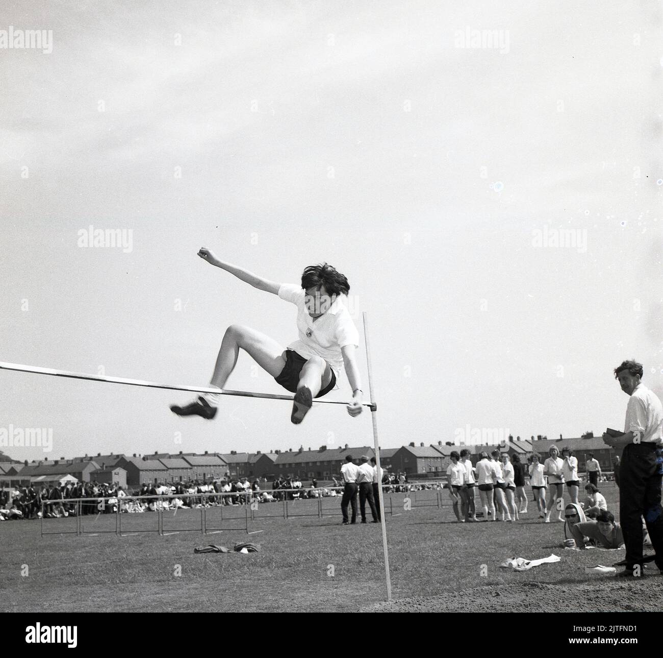 1960s, historical, county school sports, a boy doing the high jump