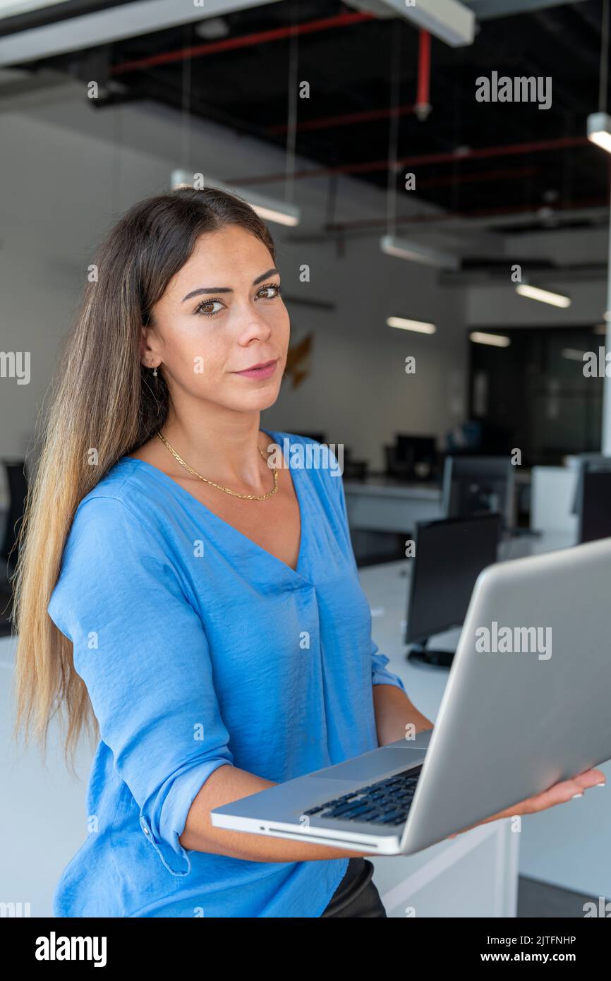 Businesswoman on laptop at office - stock photo Stock Photo