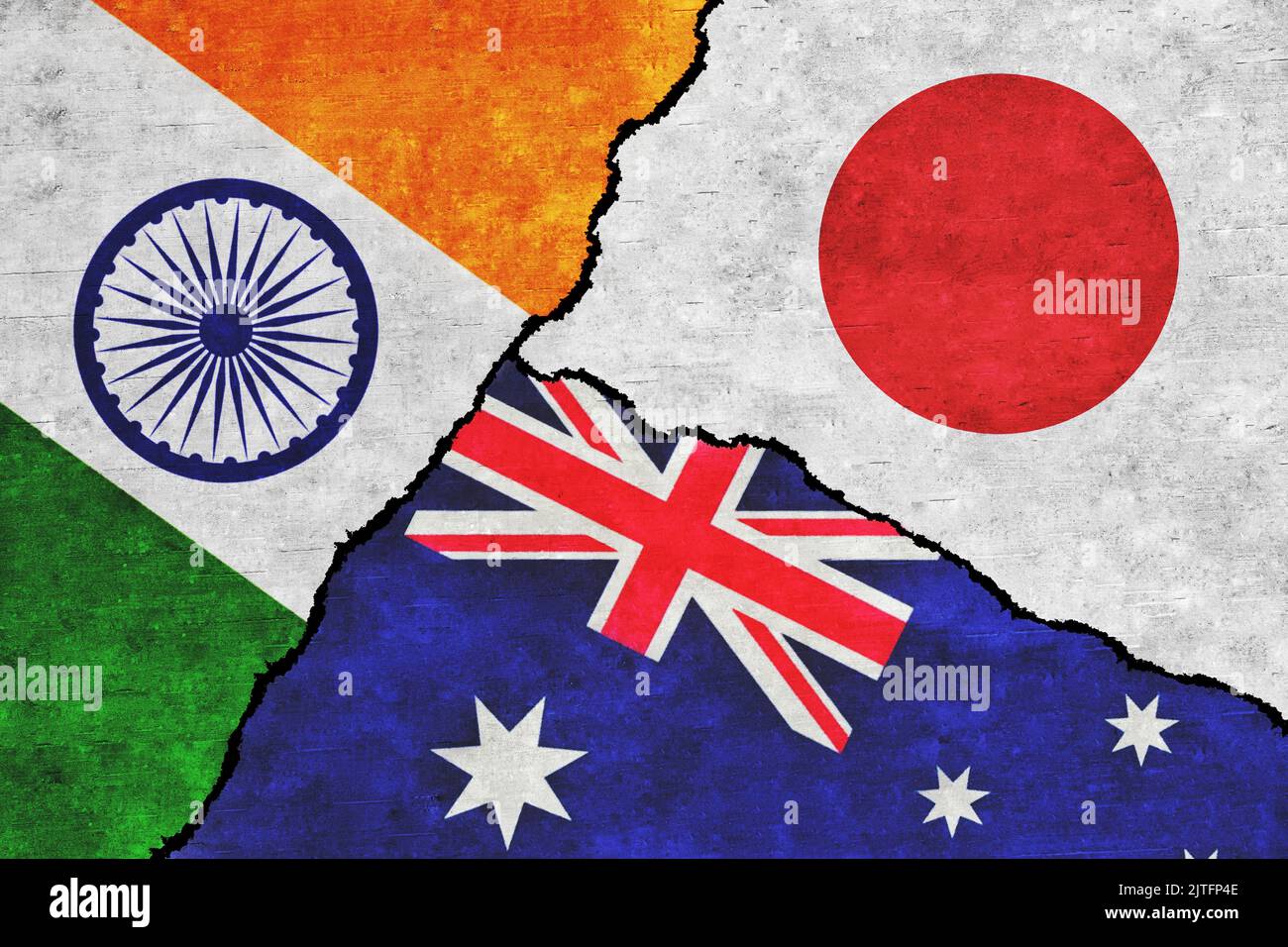 India, Australia and Japan painted flags on a wall with a crack. India, Japan and Australia relations Stock Photo