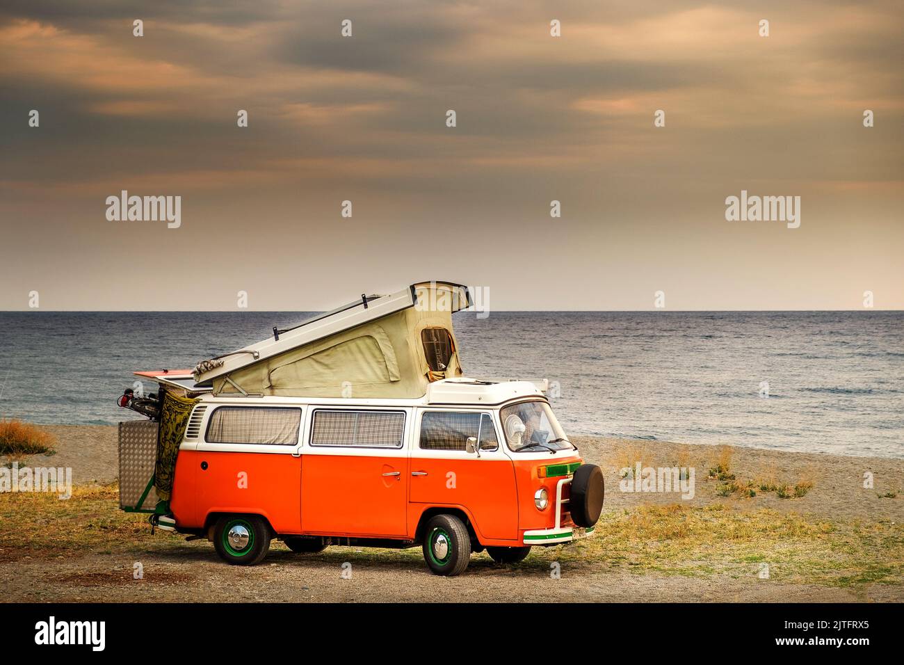 Volkswagen t2 camper Westfalia van or bus parked in the shore of Agiokampos beach ,Greece Stock Photo