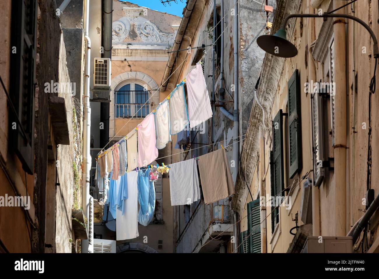 View of Corfu town with laundry hanging on clotheslines outside the