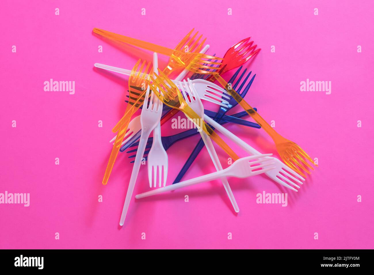 plastic littering ecology problem disposable forks Stock Photo