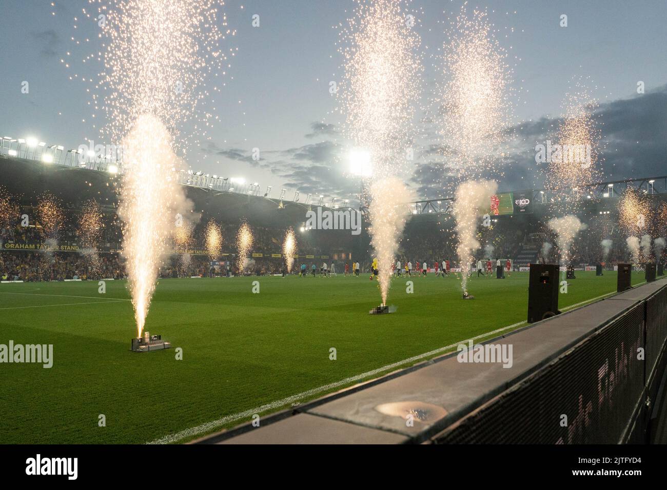 Watford, UK. 30th Aug, 2022. Middlesbrough and Watford team walk on to a Firework display to celebrate 100 years at Vicarage Road for Watford in Watford, United Kingdom on 8/30/2022. (Photo by Richard Washbrooke/News Images/Sipa USA) Credit: Sipa USA/Alamy Live News Stock Photo