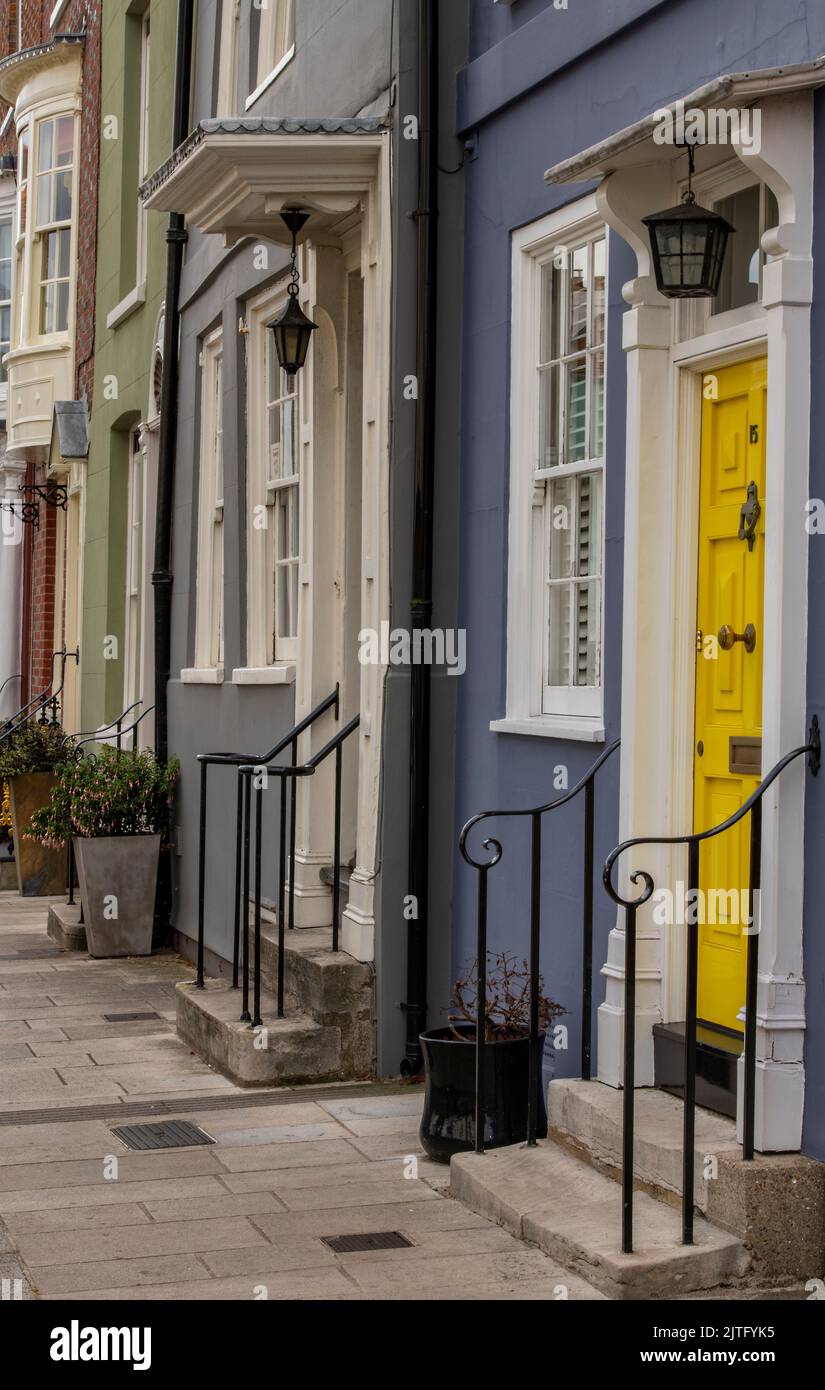 row of colourful front doors on historic houses in old portsmouth uk