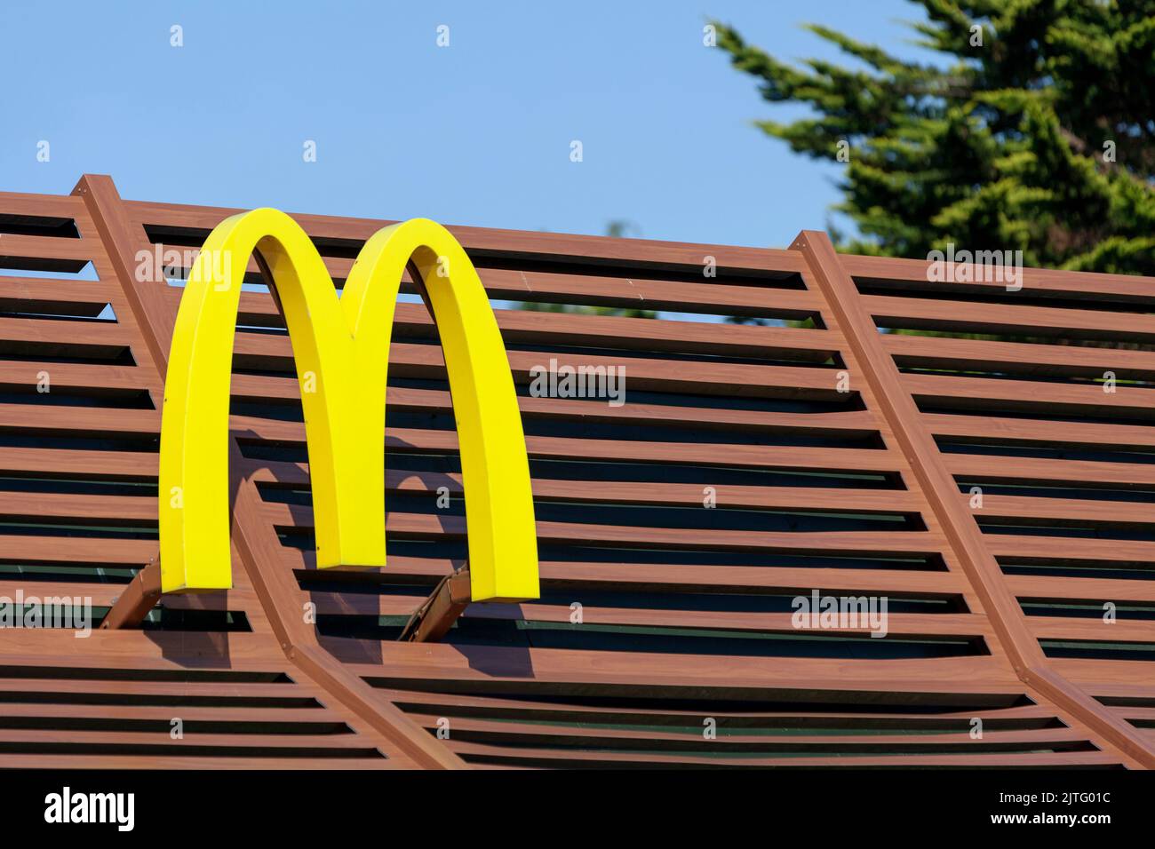 Morlaix, France - August, 29 2022: Sign of McDonald's, an American-based multinational chain of hamburger fast food restaurants. Stock Photo