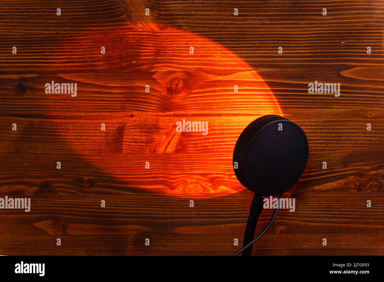 Sunset projector lamp on the table. Multi colored RGB light. Home decor. Copy space Stock Photo