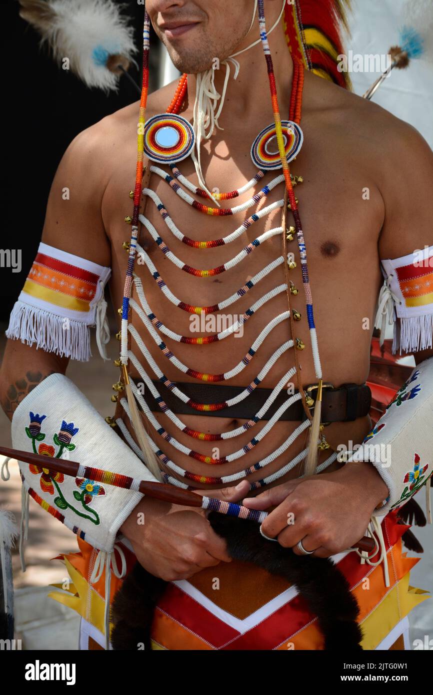 Clothes Making Contest A Native American man competes in the Native American Clothing Contest ...