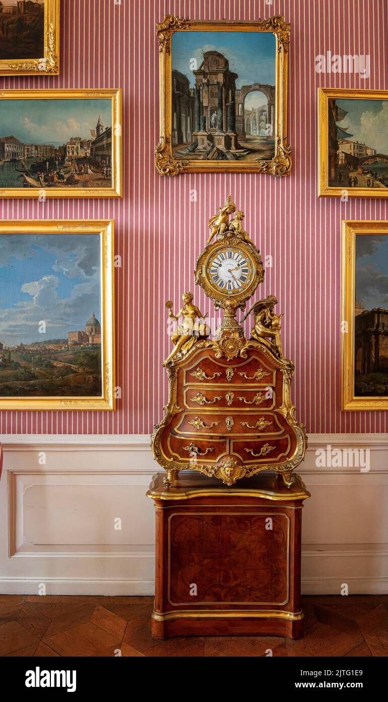 Historical Clock On Baroque Furniture, Sanssouci Palace, Potsdam, Brandenburg, Germany Stock Photo