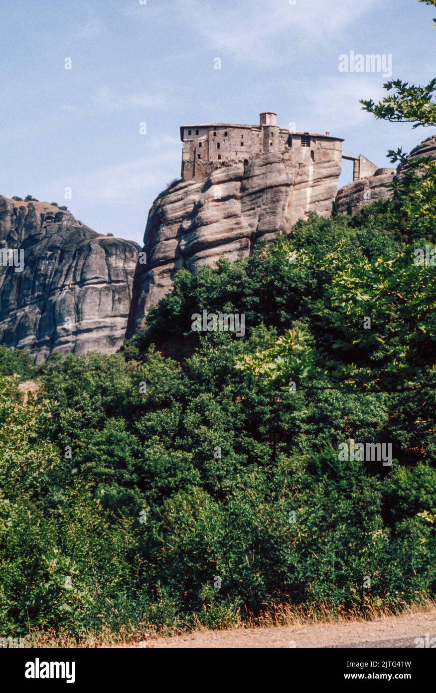 Monastery of Rousanou at The Meteora - a rock formation in central Greece hosting one of the largest and most precipitously built complexes of Eastern Orthodox monasteries. March 1980. Archival scan from a slide. Stock Photo