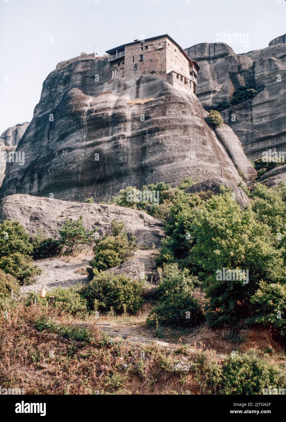 Monastery of St. Nicholas Anapausas at The Meteora - a rock formation in central Greece hosting one of the largest and most precipitously built complexes of Eastern Orthodox monasteries. March 1980. Archival scan from a slide. Stock Photo