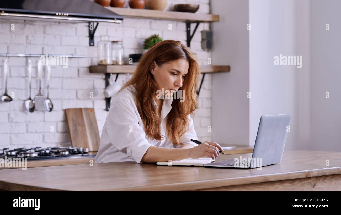 A caucasian business woman working on laptop in the office Stock Photo ...