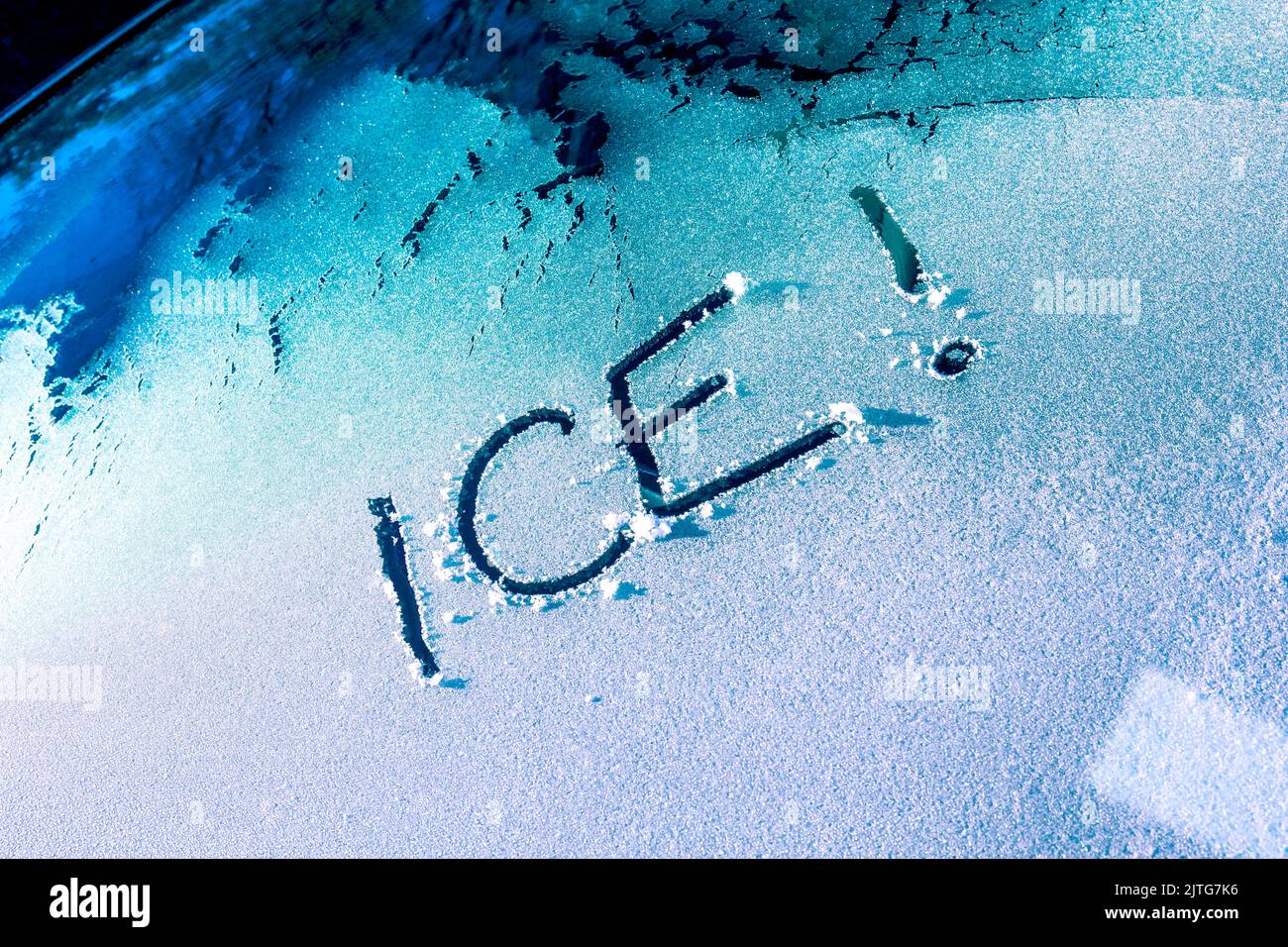The word Ice scraped onto a car windscreen windshield Stock Photo