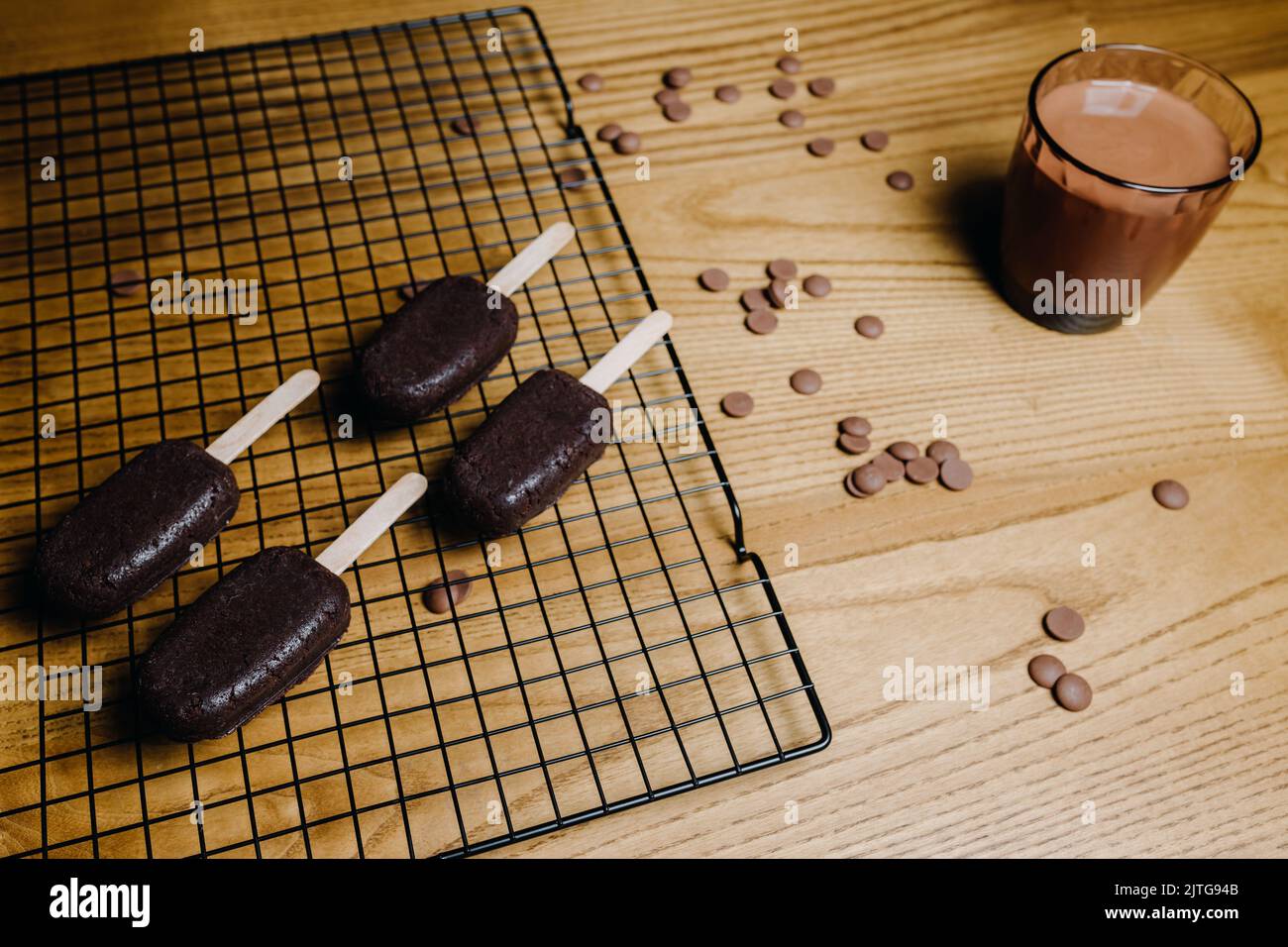 Beautiful candy bar decoration, cake in the form of ice cream with chocolate. Preparation of cupcakes Stock Photo