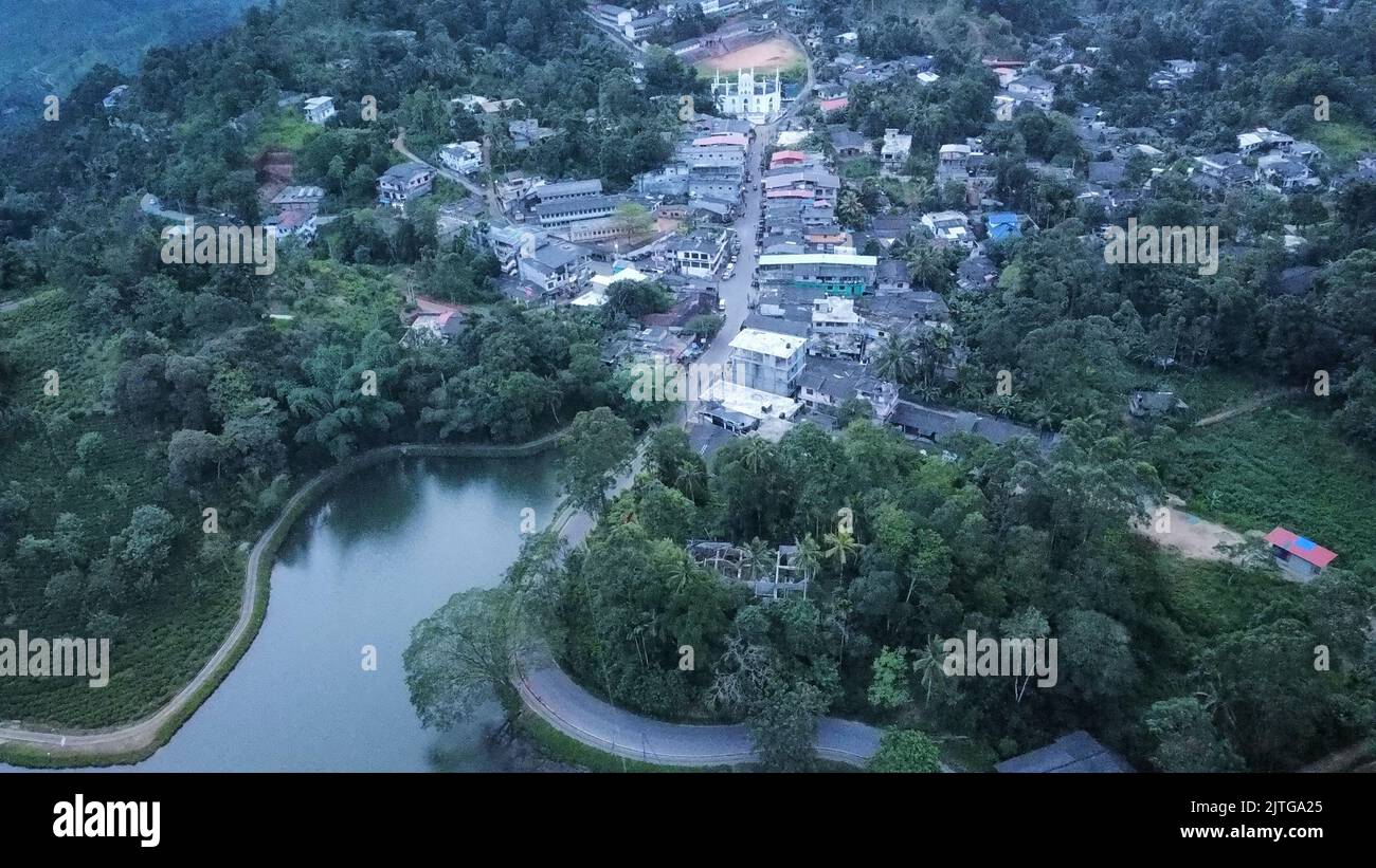 An aerial view. of houses and buildings in a small town by the river ...