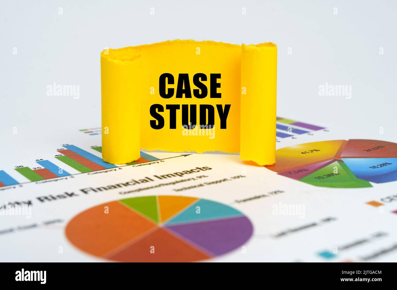 Business concept. Against the background of graphs and charts, a yellow paper plate with the inscription - CASE STUDY Stock Photo