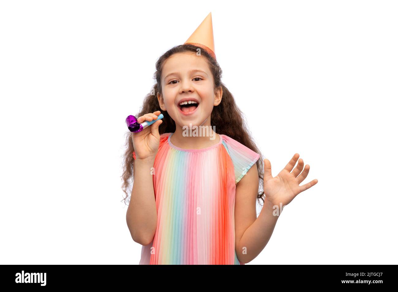 smiling girl in birthday party hat with blower Stock Photo - Alamy