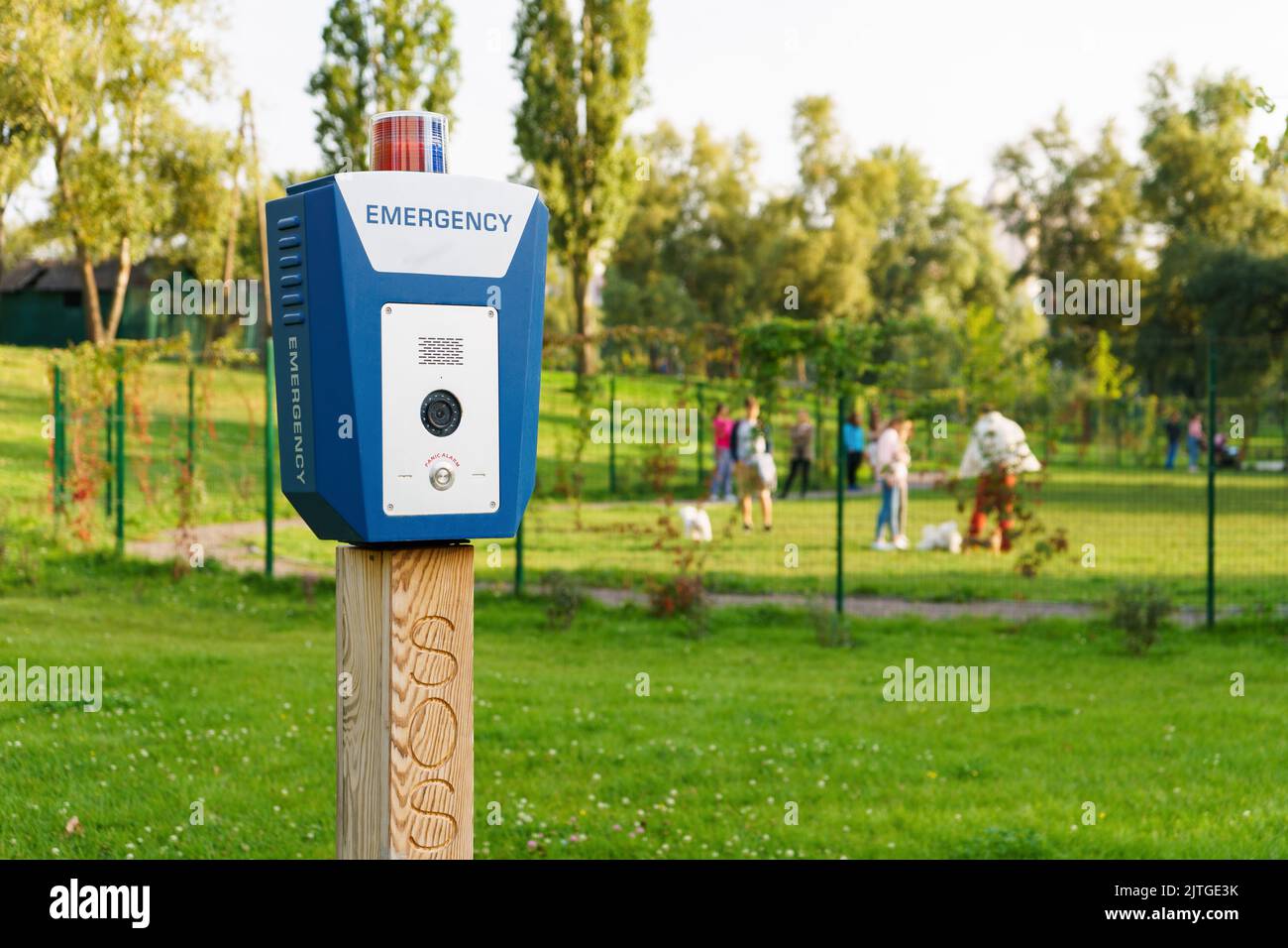 Panic alarm, police, emergency button in the public park. Blue box with