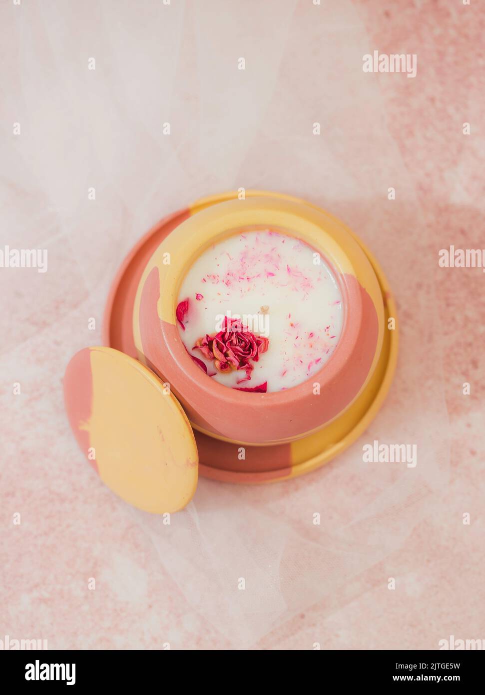 Soy candle in a concrete, plaster candlestick, decor interior. Home