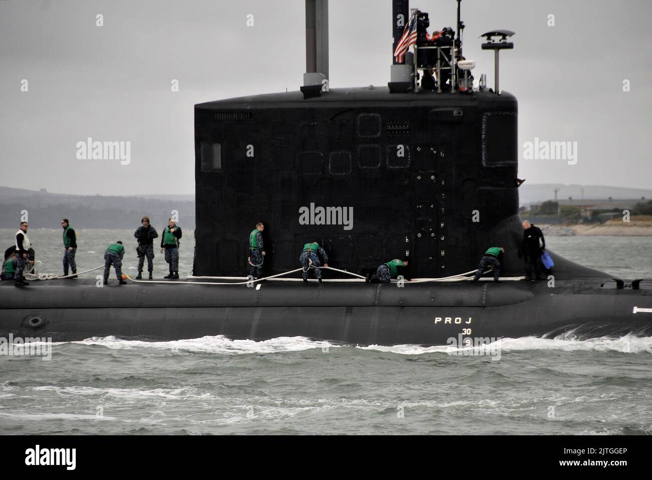 US Navy Engineman 2nd Class Anthony Bartelli (right) holds an