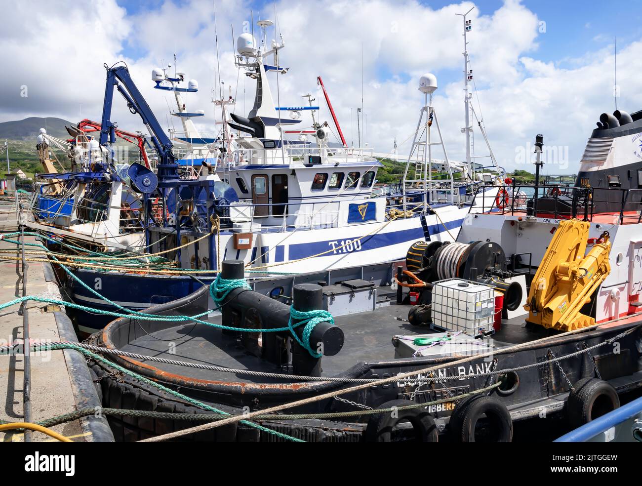 Fishing Boats lined up in the Harbour in Castletownbere, County Cork, Ireland Stock Photo