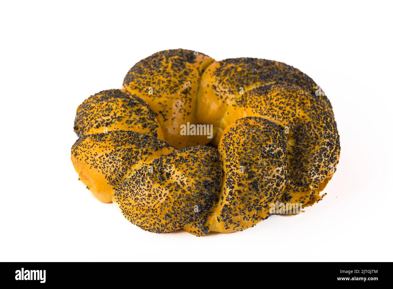 Round braided white wheat bread with poppy seed topping. Isolated on