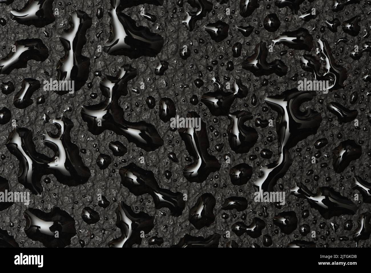 Water droplets on a black vinyl faux leather surface giving it a chrome-like, alien type of look Stock Photo