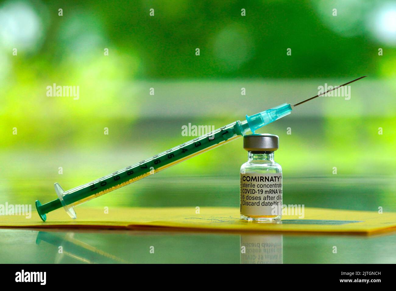 syringe with vaccine from Biontech Pfizer against Covid Stock Photo