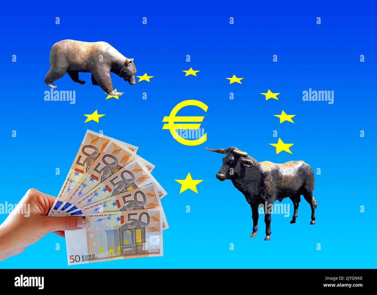 bull and bear and hand with 50-euro notes in front of euro star, symbolic image for speculation on the stock exchange Stock Photo