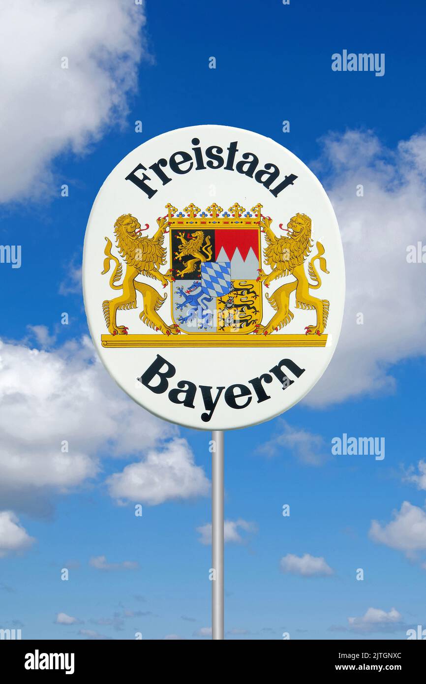 Sign Freistaat Bayern in front of blue cloudy sky, Germany, Bavaria Stock Photo