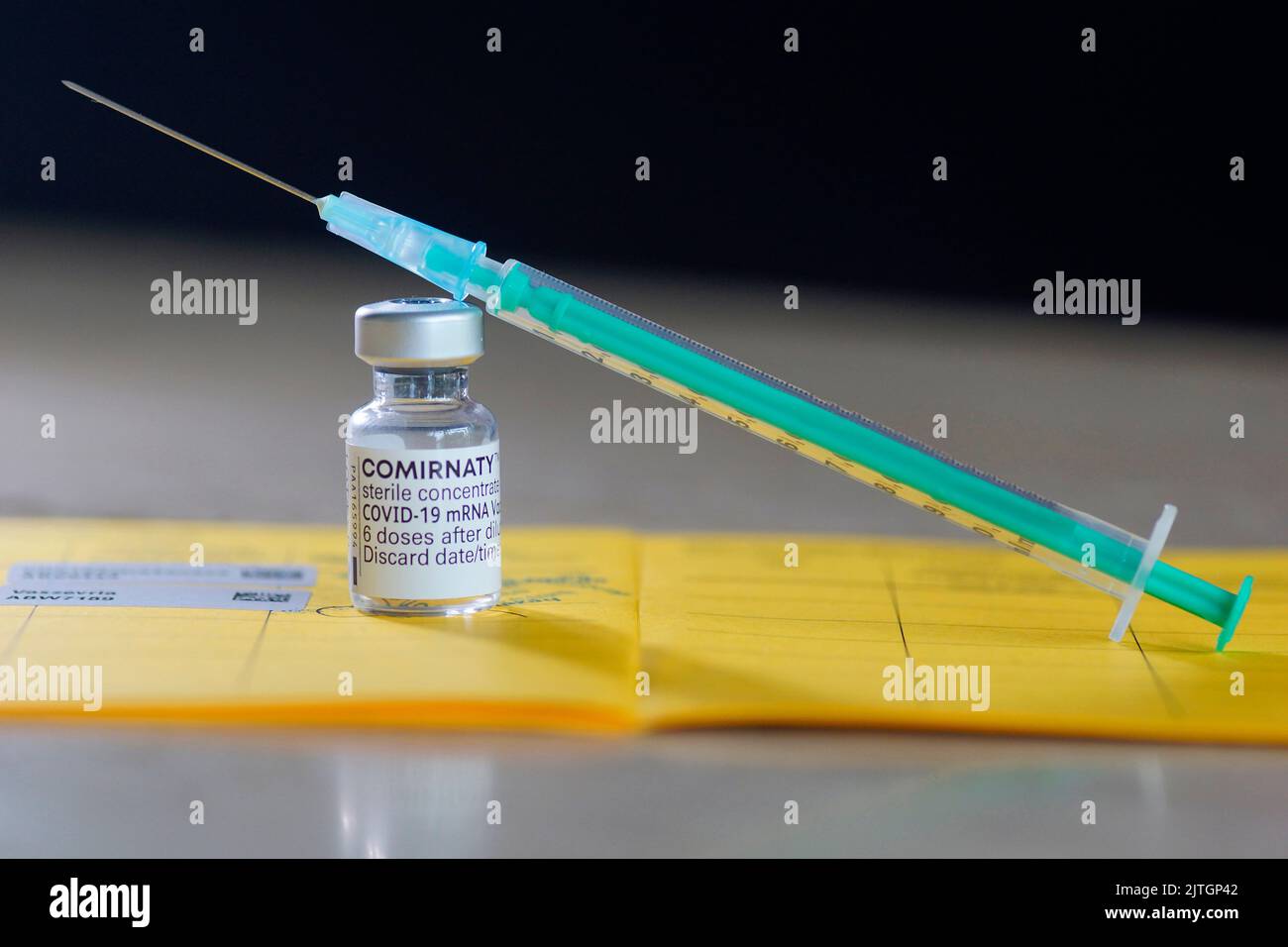 Syringe with vaccine from Biontech Pfizer against Covid Stock Photo