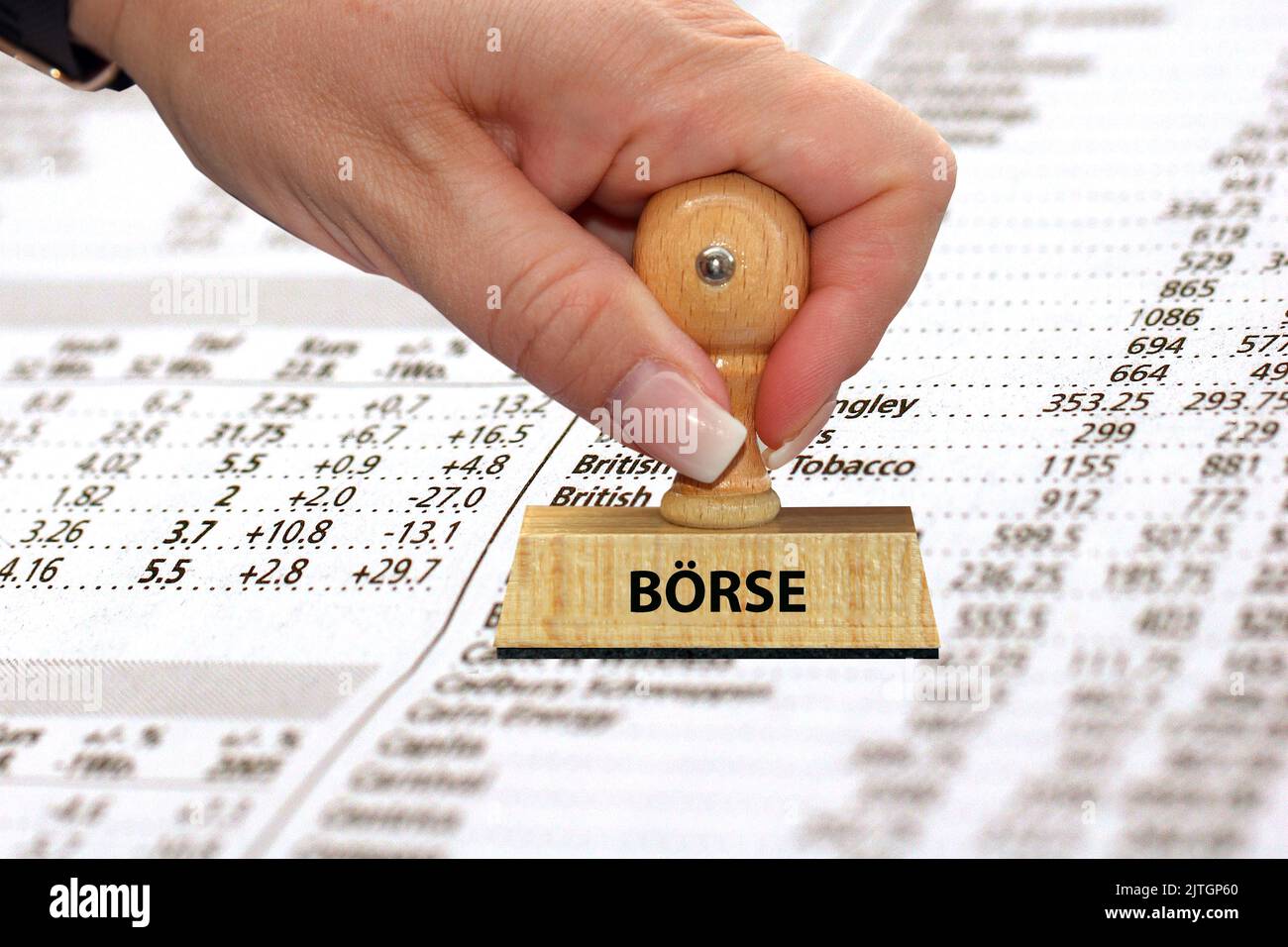 stamp 'Stock Exchange, Boerse' in front of newspaper with share prices Stock Photo