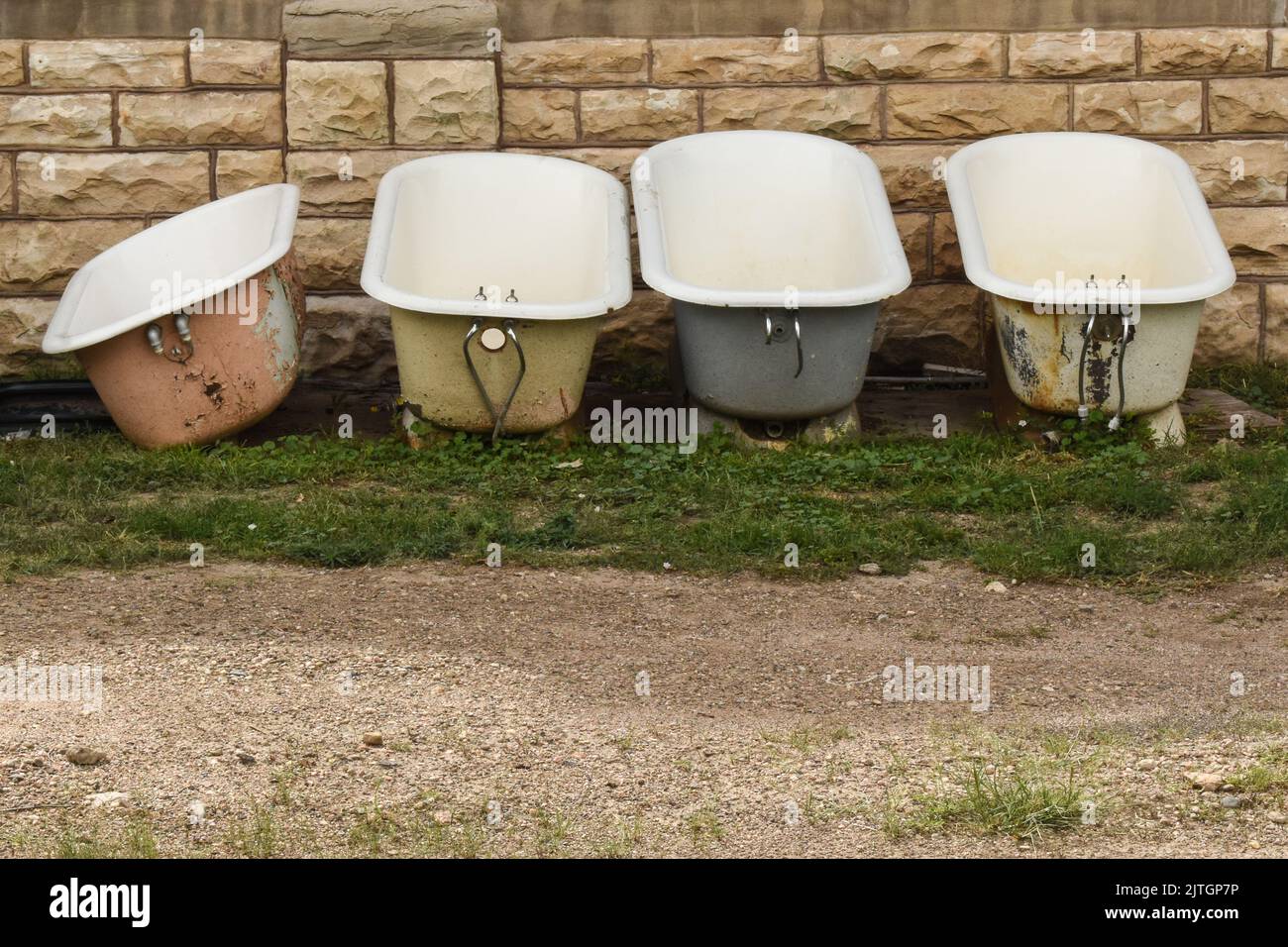 Four old clawfoot bathtubs Stock Photo Alamy