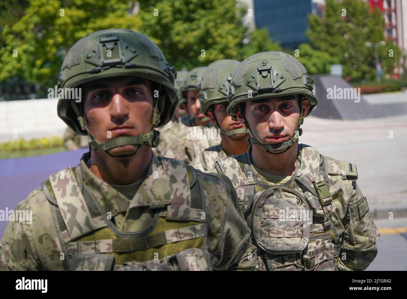 Turkish soldiers march with a Turkish flag during the military parade ...