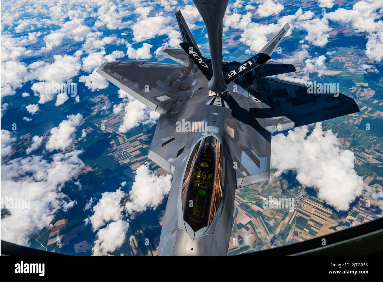 August 10, 2022 - Poland - A U.S. Air Force KC-135 Stratotanker aircraft assigned to the 100th Air Refueling Wing, Royal Air Force Mildenhall, England refuels a U.S. Air Force F-22 Raptor aircraft assigned to the 90th Fighter Squadron, Joint Base Elmendorf-Richardson, Alaska, over Poland, Aug. 10, 2022. The 100th ARW provides the critical air refueling bridge that enables strategic assets to operate in forward locations, and postures NATO forces to extend global reach and amplify operational capability throughout Europe. (Credit Image: © U.S. Air Force /ZUMA Press Wire Service/ZUMAPRESS.com) Stock Photo