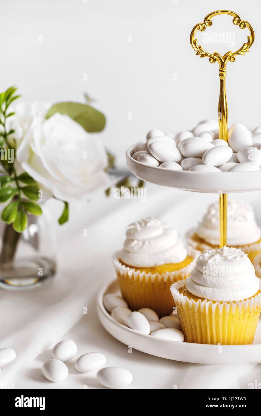 Vanilla cupcakes on a cake stand Stock Photo